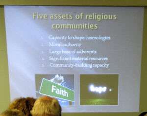 Joe Gunn shares a slide from a talk about faith communities in the climate struggle